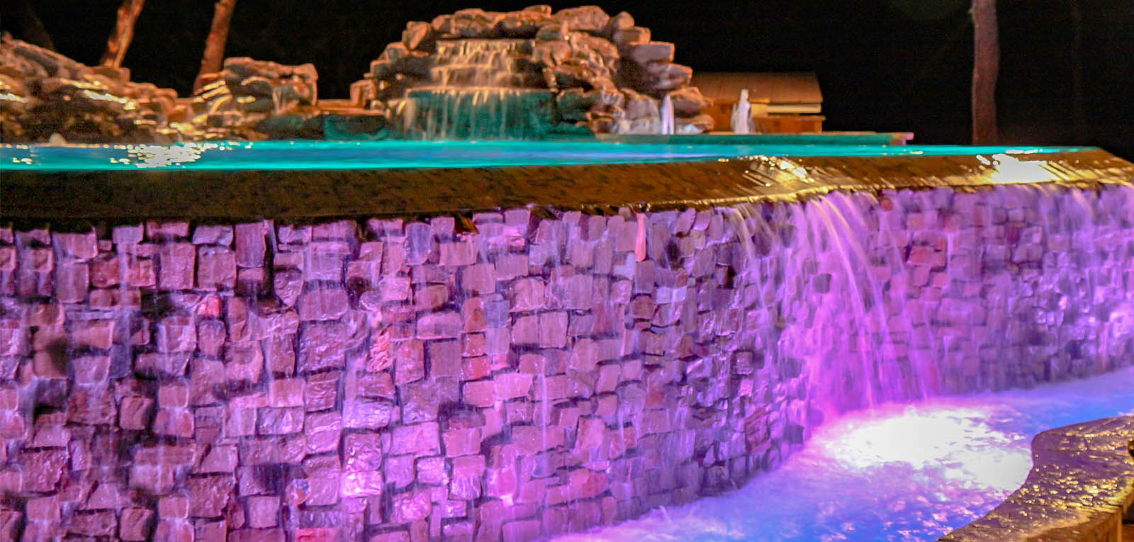 Inground pool with purple and blue LED lighting