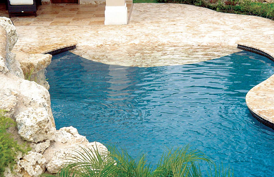 Showcasing inground pool with beach entry design
