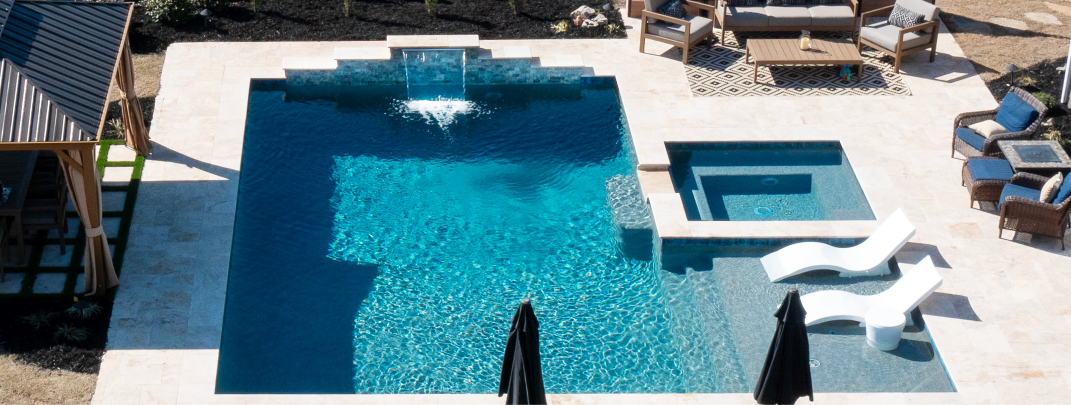 Sleek modern Atlanta pool with square spa and tanning ledge,