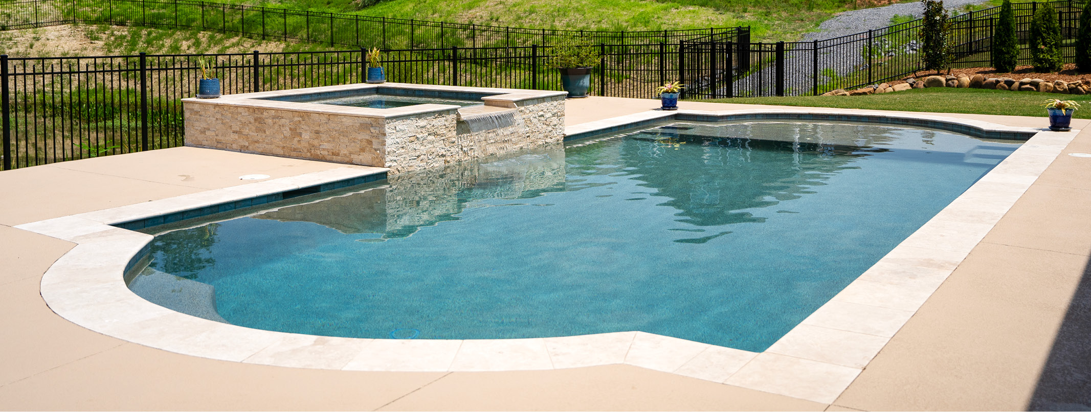 Roman-shaped swimming pool with spa in Atlanta.