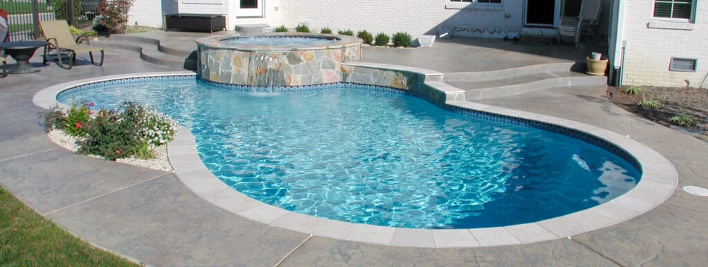 Indianapolis custom pool with stone-faced spa.