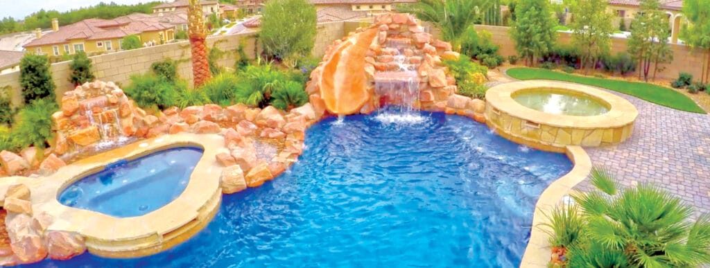 Rock waterfalls and spa on custom swimming pool in Laughlin.
