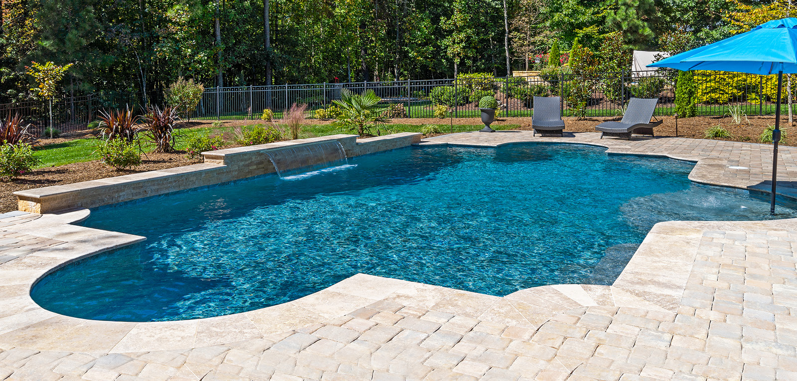 Modified Roman pool with paver decking.