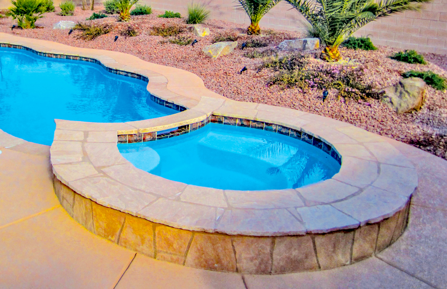 Round gunite spa with inverted side custom detailing