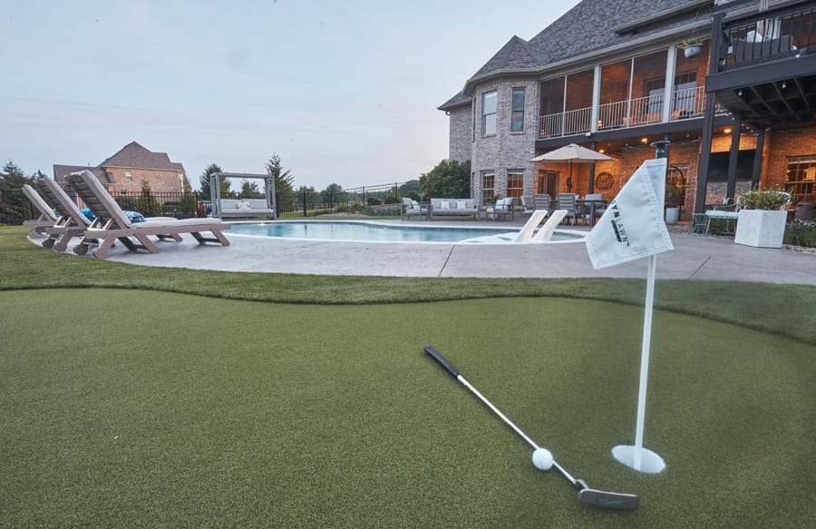 Luxury backyard with swimming pool and putting green