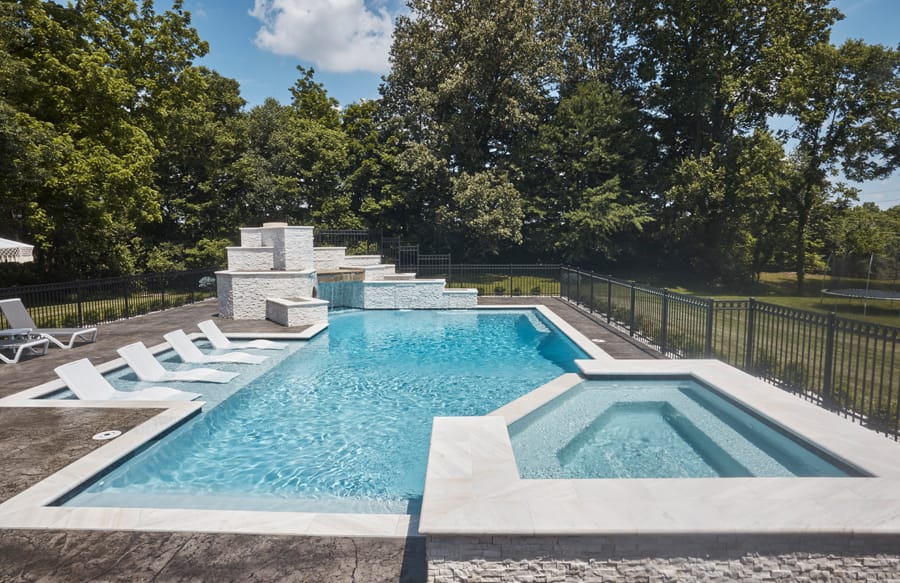 Geometric swimming pool with elevated spa and modern design