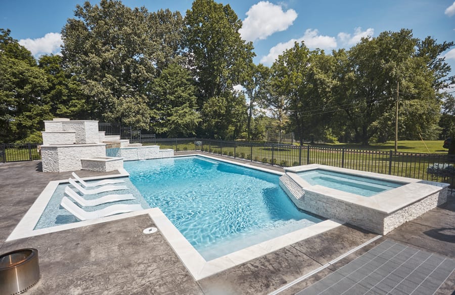 Geometric swimming pool with spillover spa
