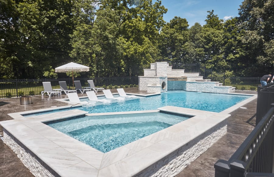 Luxury swimming pool with raised spa and premium finishes