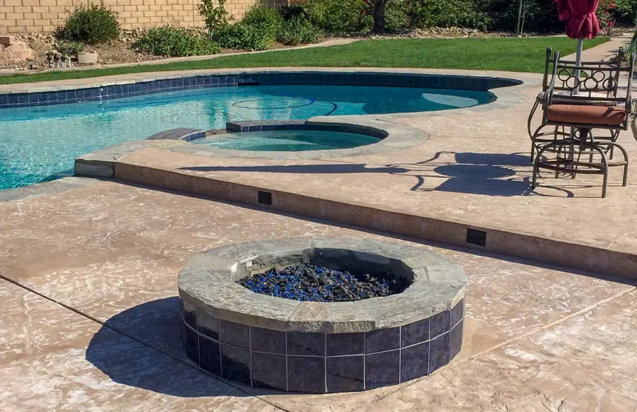 Beautiful backyard pool with custom landscaping design