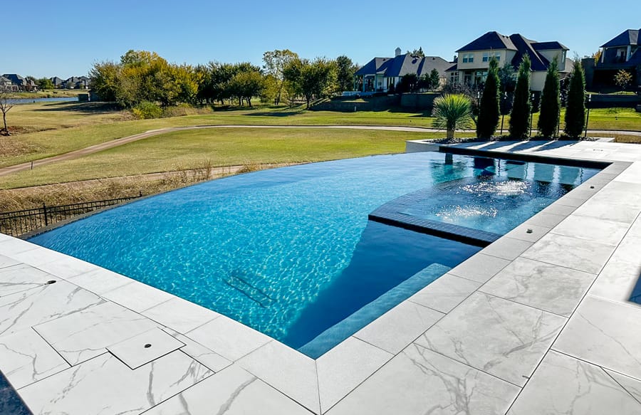 Luxury custom inground swimming pool in a residential Oklahoma City backyard