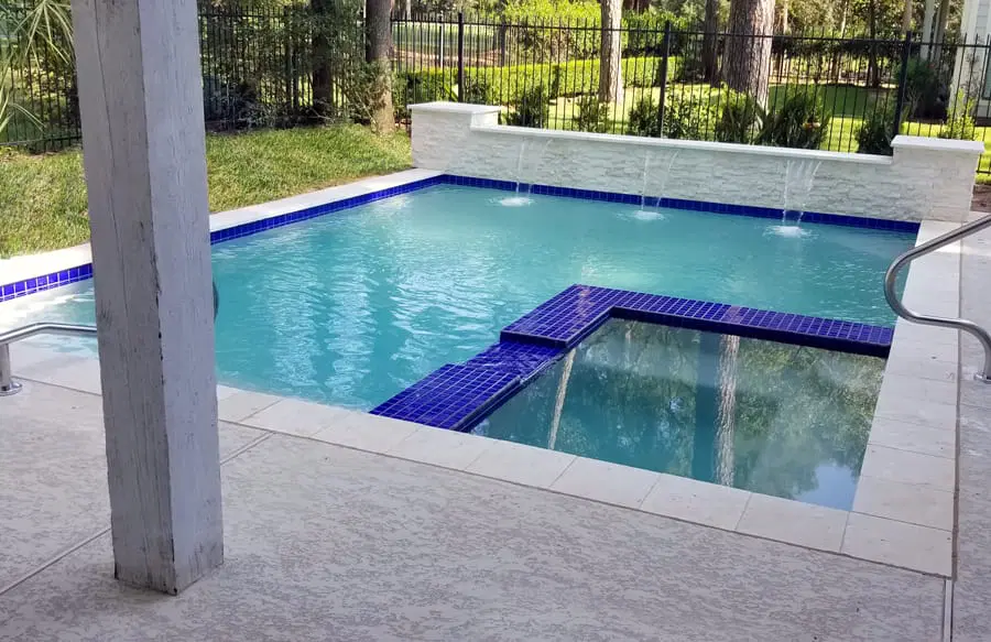 Inground swimming pool with custom backyard design