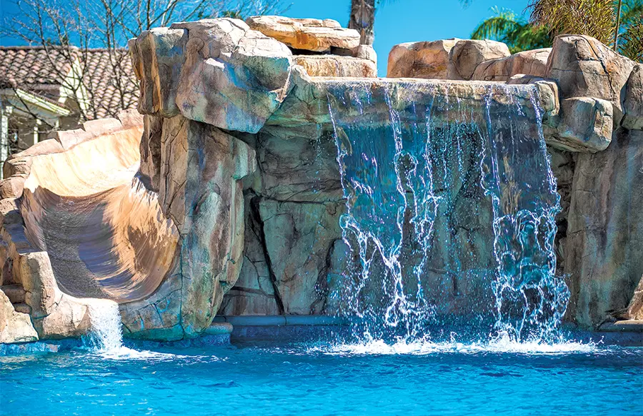 Outdoor pool area featuring custom design elements
