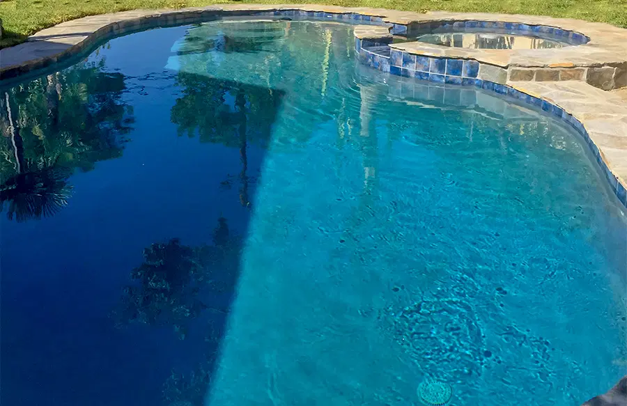 Luxury pool installation with creative backyard design