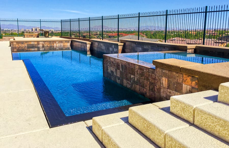 Custom swimming pool with outdoor living space