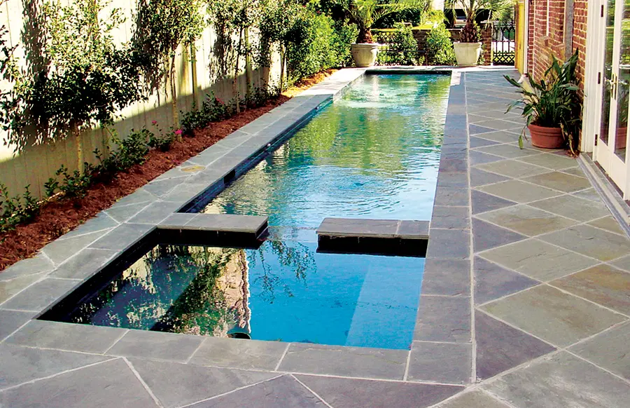 Custom pool installation featuring outdoor living space