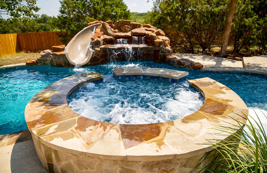 Modern backyard pool with attractive outdoor features