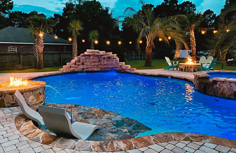Pensacola inground pool with custom outdoor features