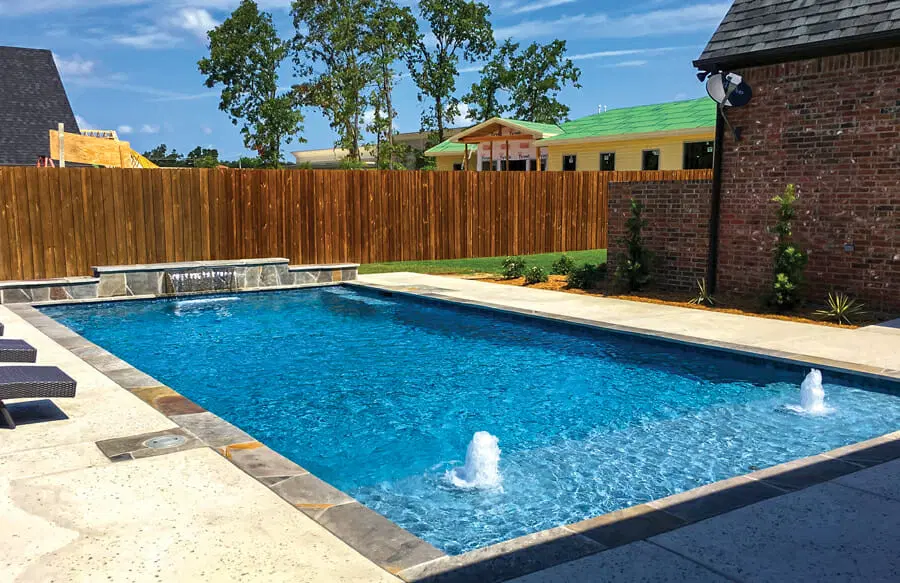 Residential pool installation with modern outdoor features
