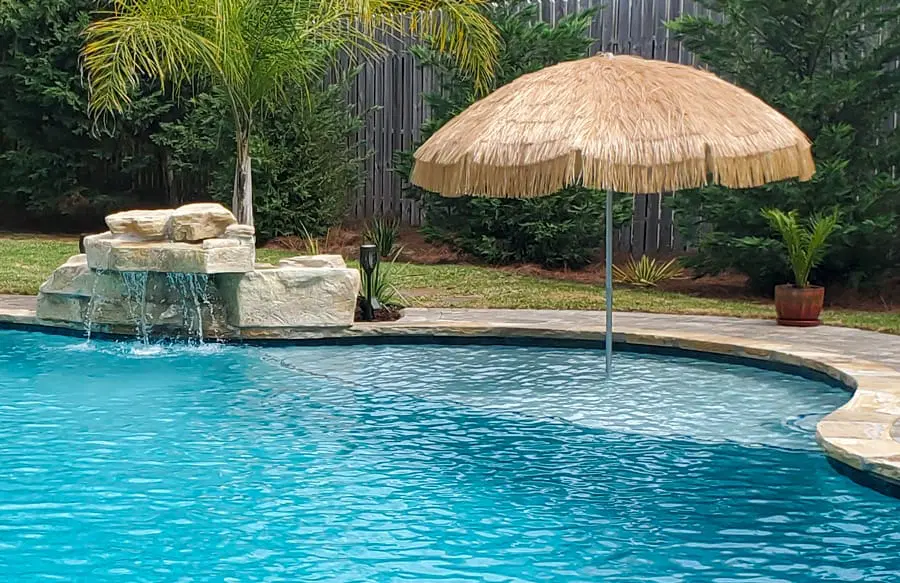 Elegant backyard pool design with custom features