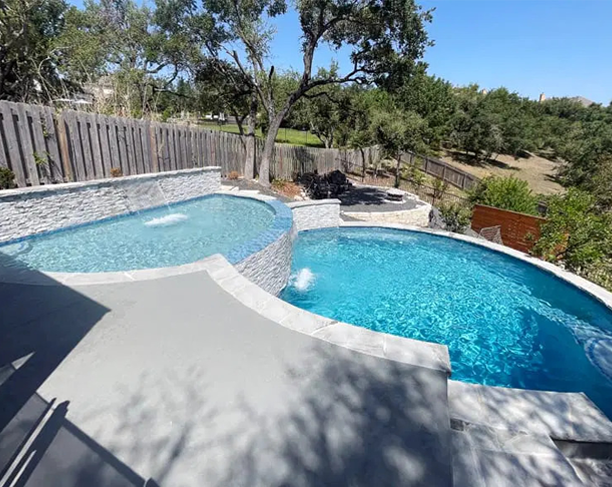Luxury custom inground swimming pool in San Antonio backyard