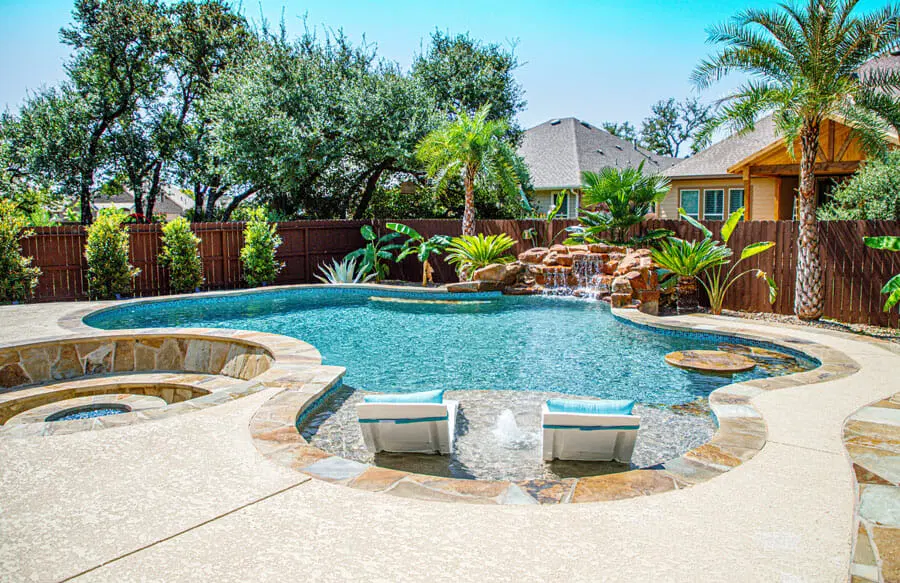 Contemporary inground pool with custom patio design in San Antonio