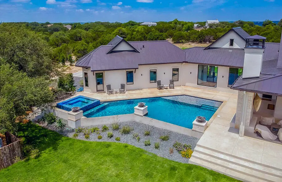 Premium backyard swimming pool with stylish hardscape in San Antonio