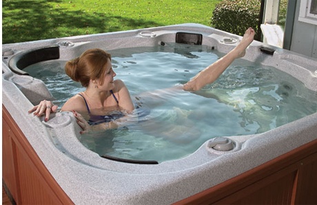 woman exercising in hot tub