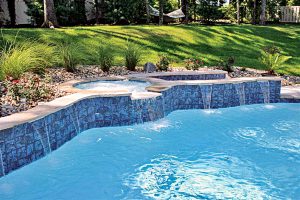 Freeform pool with spillover spa waterfall St Louis