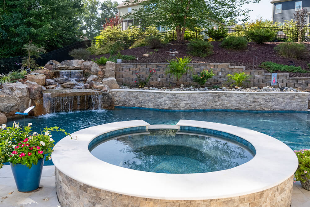 Modernize freeform pool with waterfall and spa enhancements