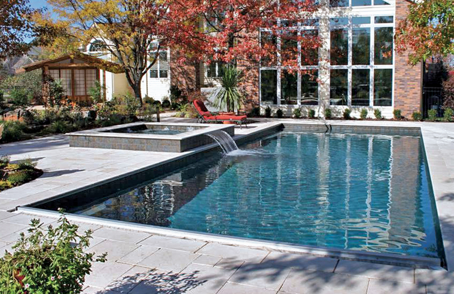 Modern rectangular inground pool with dark interior finish