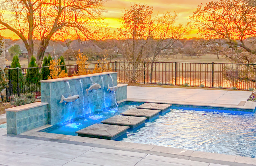 Rectangular inground pool with custom fountains and water features