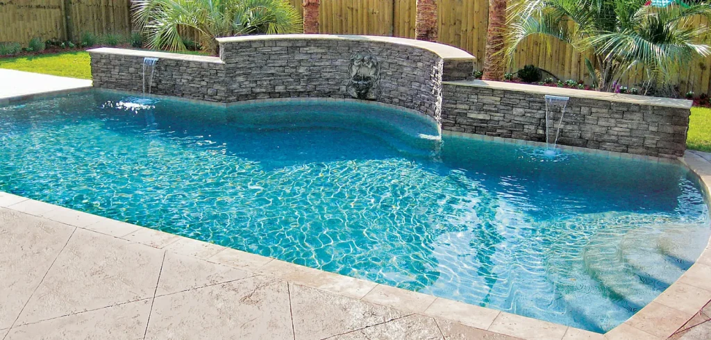 Pool with raised bond beam and cascade features