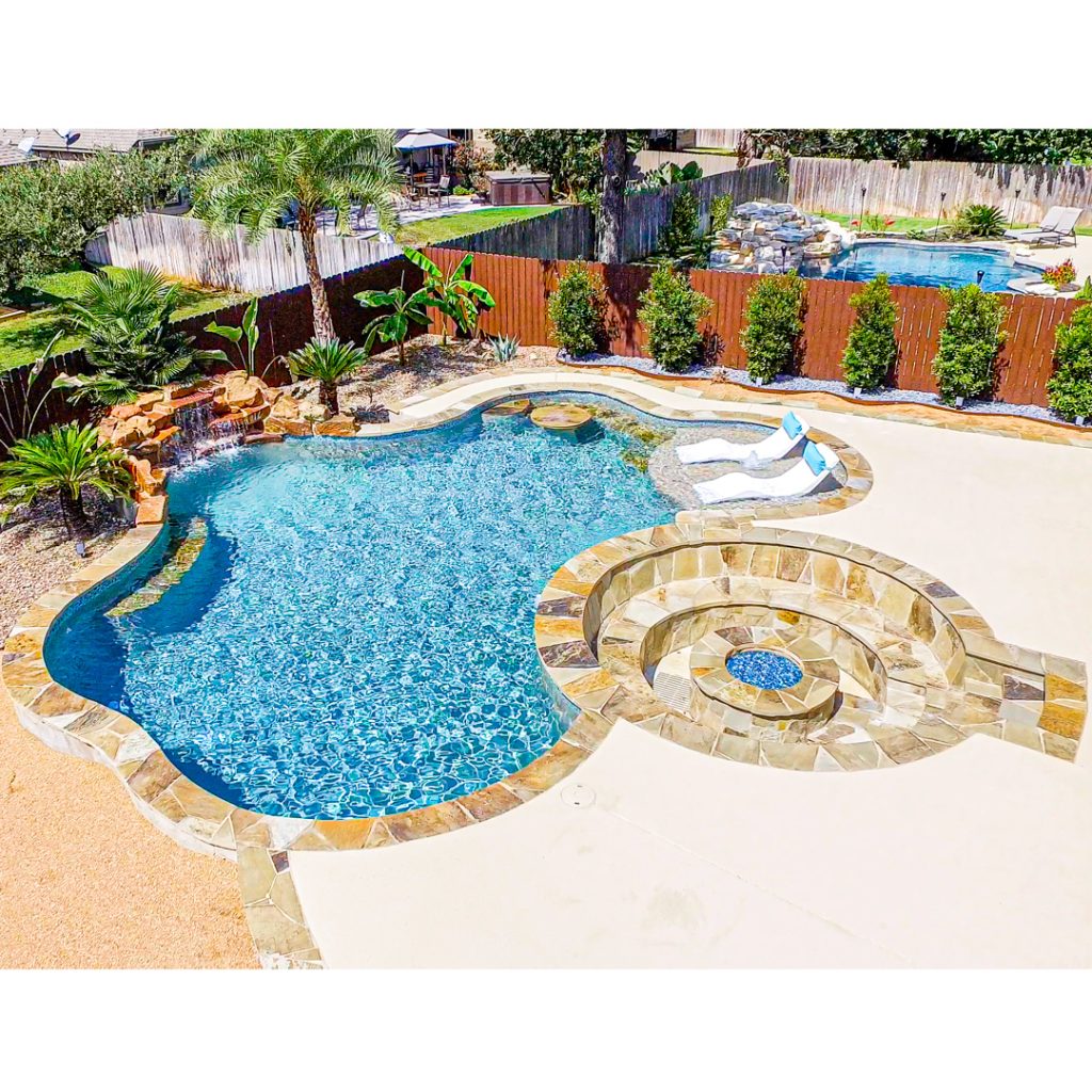 Custom lagoon-style swimming pool with natural rock features
